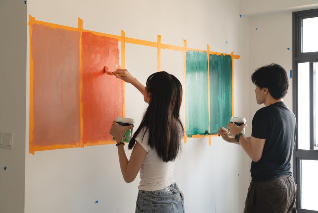 Tina and Alfred doing a paint test on site